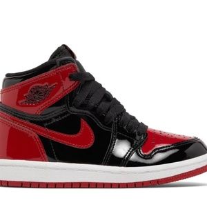 Black and red patent leather Jordan’s